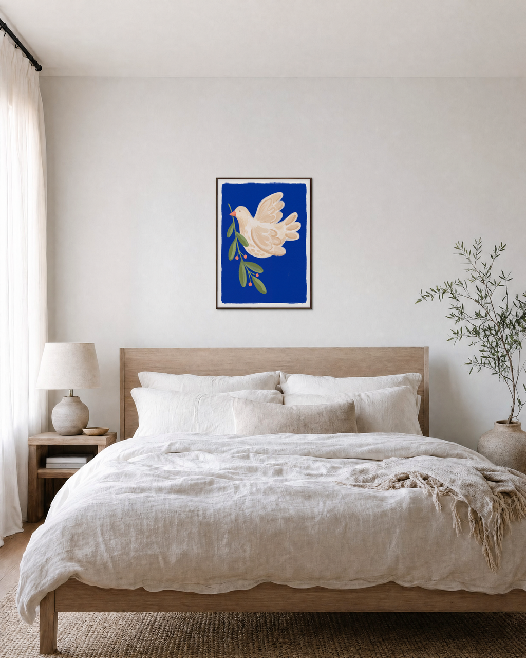 Left-Facing Bird on Blue Field blue dove wall art print: unframed print is shown framed for styling in a bedroom; frame not included