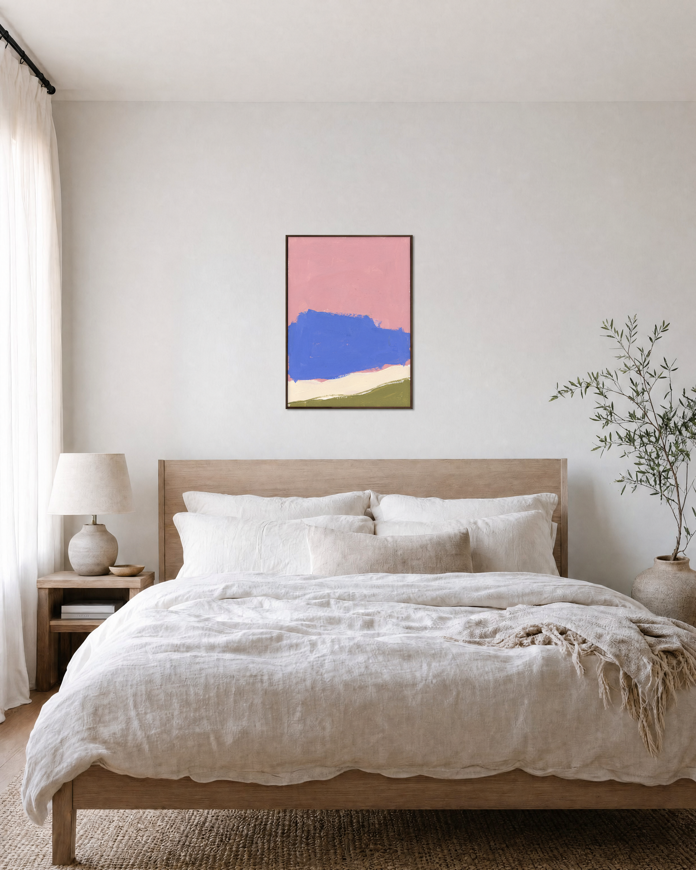 Blue Cliff Pink unframed print is shown framed for styling in a bedroom; frame not included