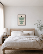 Dot Signal mint green arc wall art: unframed print is shown framed for styling in a bedroom; frame not included