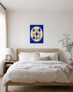 Bottle Hour cobalt bottle wall art: unframed print is shown framed for styling in a bedroom; frame not included