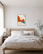 Horizon Sun unframed print is shown framed for styling in a bedroom; frame not included