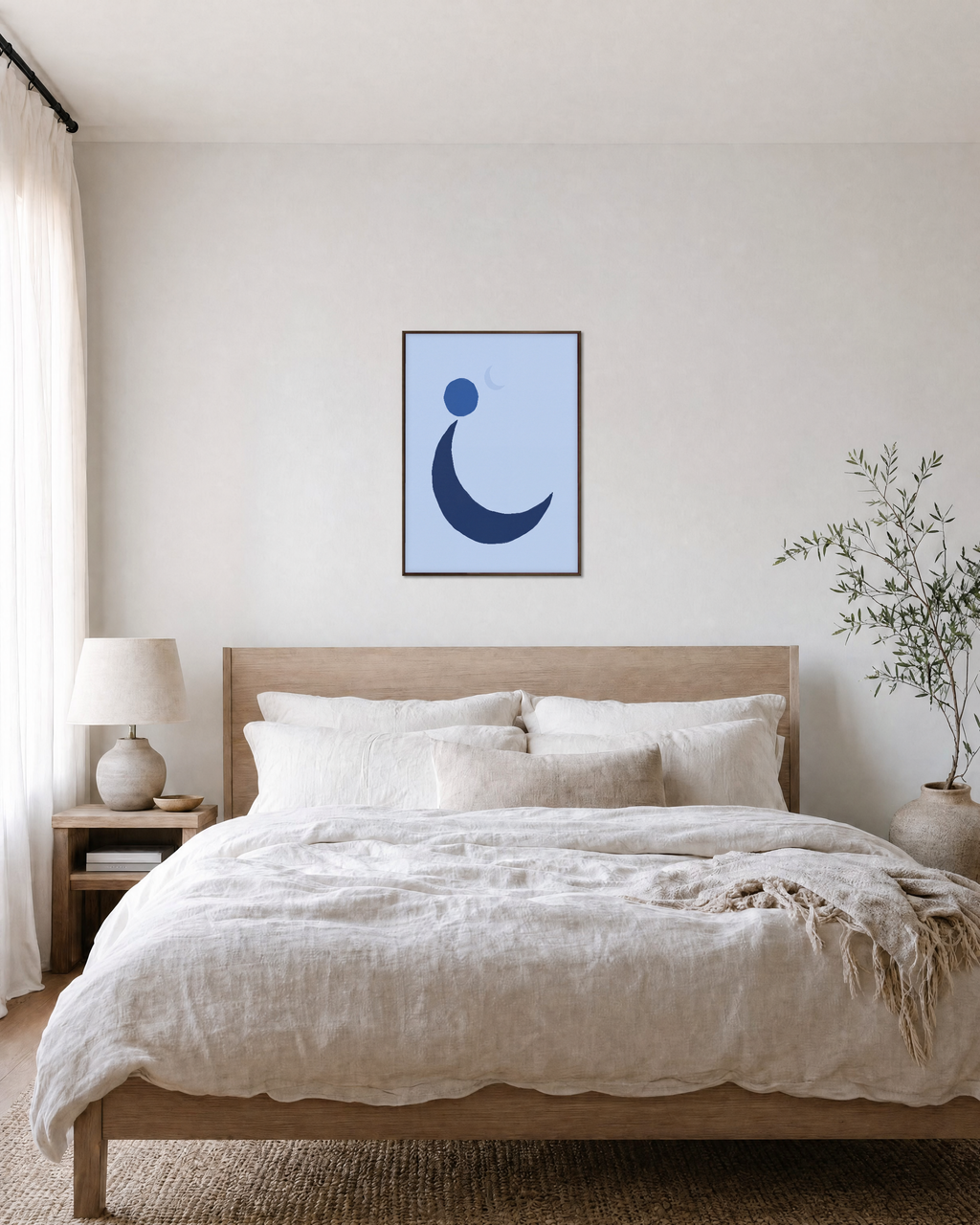 Blue Crescent unframed print is shown framed for styling in a bedroom; frame not included