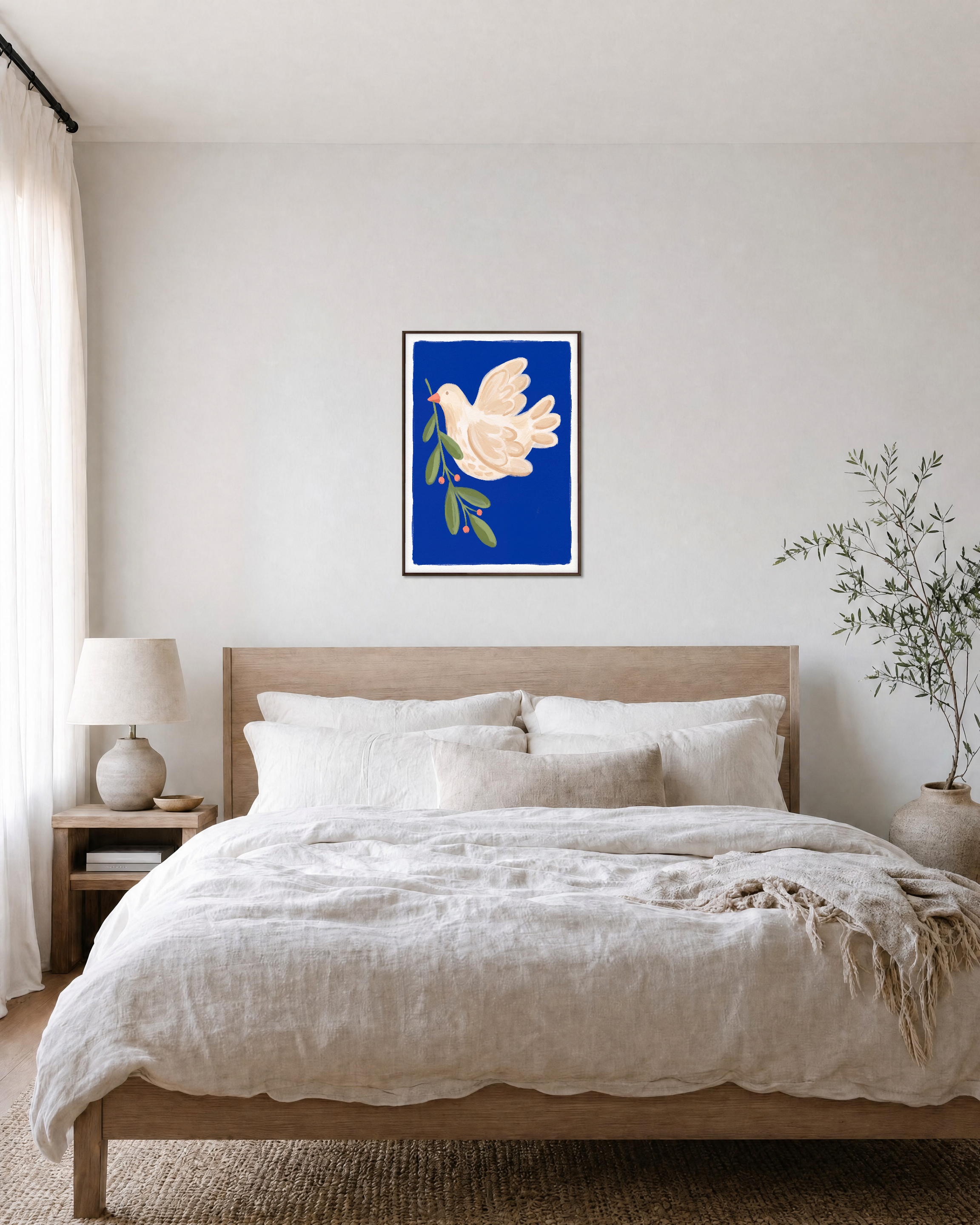 Dove Branch Blue unframed print is shown framed for styling in a bedroom; frame not included