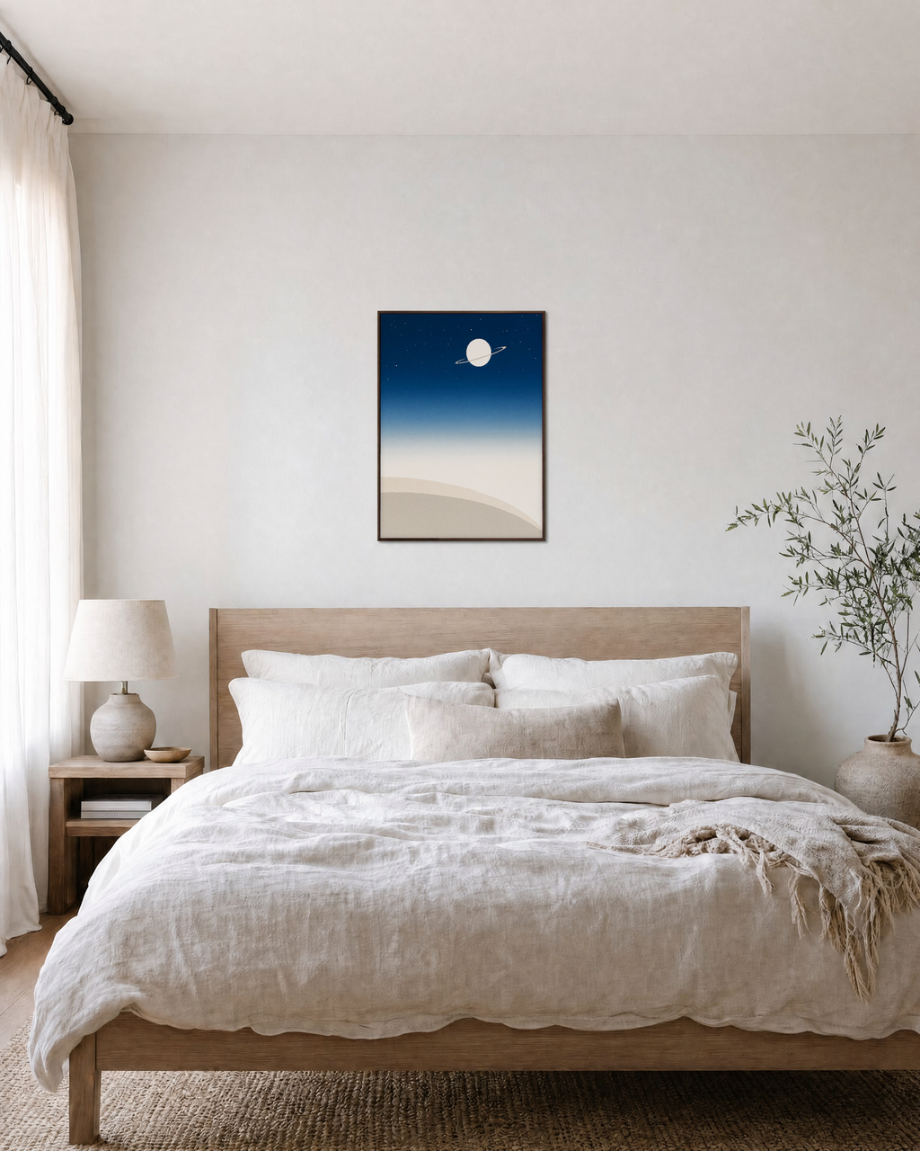 Ringed Planet Above Dunes navy blue night sky wall art: unframed print is shown framed for styling in a bedroom; frame not included
