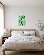 Drooping Green Flower Stems green wildflower wall art print: unframed print is shown framed for styling in a bedroom; frame not included