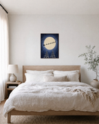 Midnight Sleigh moon sleigh print: unframed print is shown framed for styling in a bedroom; frame not included