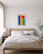 Three Color Slabs One Circle unframed print is shown framed for styling in a bedroom; frame not included