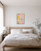 Peony Weather pastel peony wall art: unframed print is shown framed for styling in a bedroom; frame not included