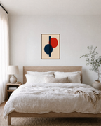 Two Circles One Rectangle Stack unframed print is shown framed for styling in a bedroom; frame not included