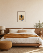 Black Cat in Shipping Box unframed print is shown framed for styling in a bedroom; frame not included