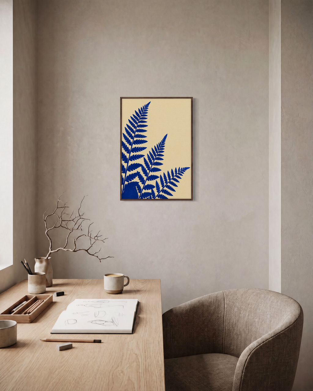 Three Fern Cuts Cobalt unframed print is shown framed for styling in a home office; frame not included