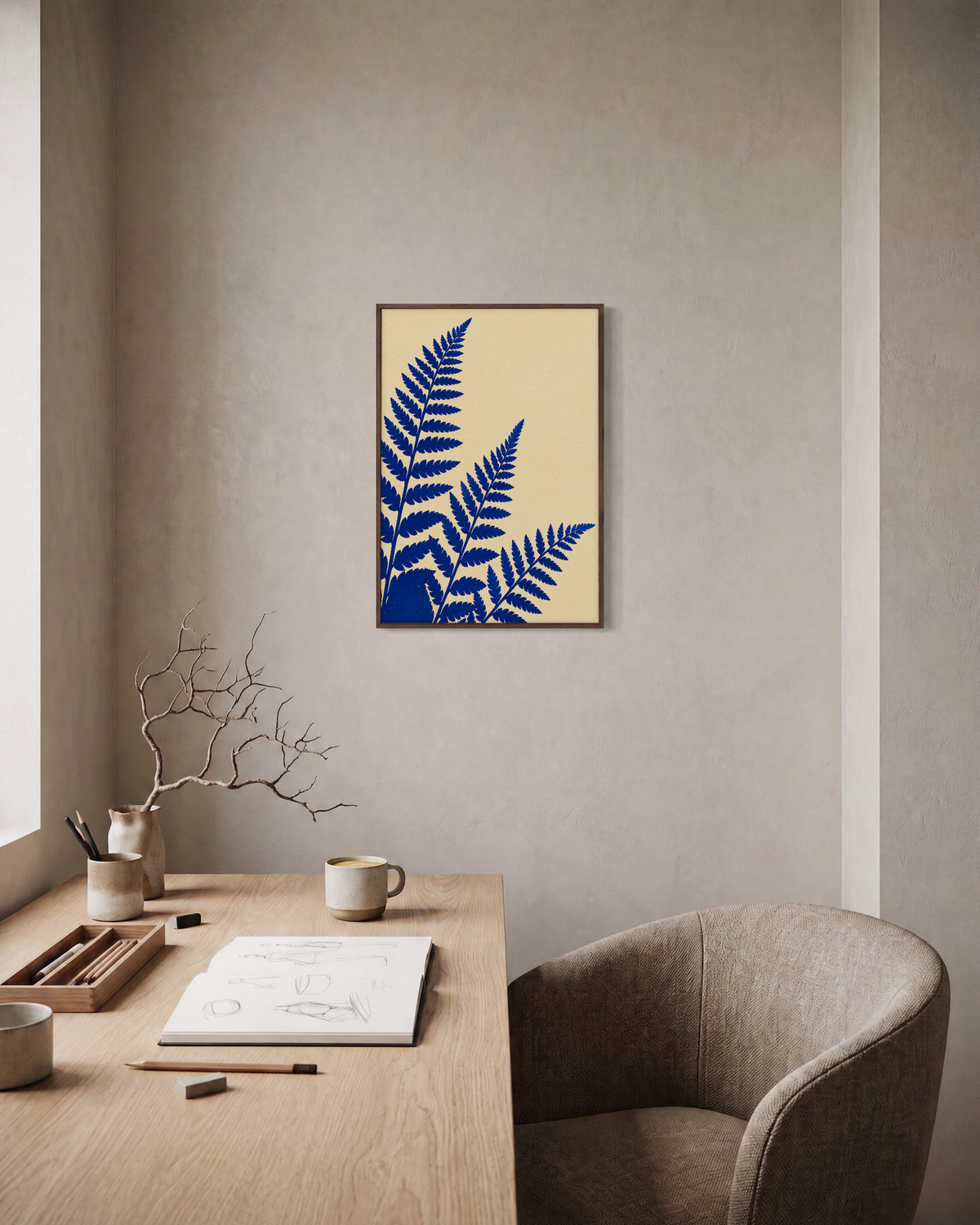 Three Fern Cuts Cobalt unframed print is shown framed for styling in a home office; frame not included