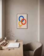Three Offset Rings One Bar unframed print is shown framed for styling in a home office; frame not included