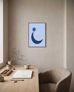 Blue Crescent unframed print is shown framed for styling in a home office; frame not included