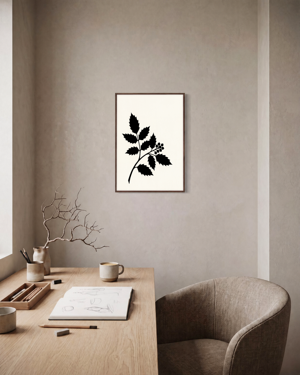 Black Leaf Sprig unframed print is shown framed for styling in a home office; frame not included