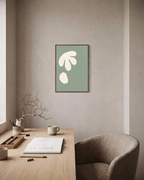 Cream Cutouts Sage unframed print is shown framed for styling in a home office; frame not included