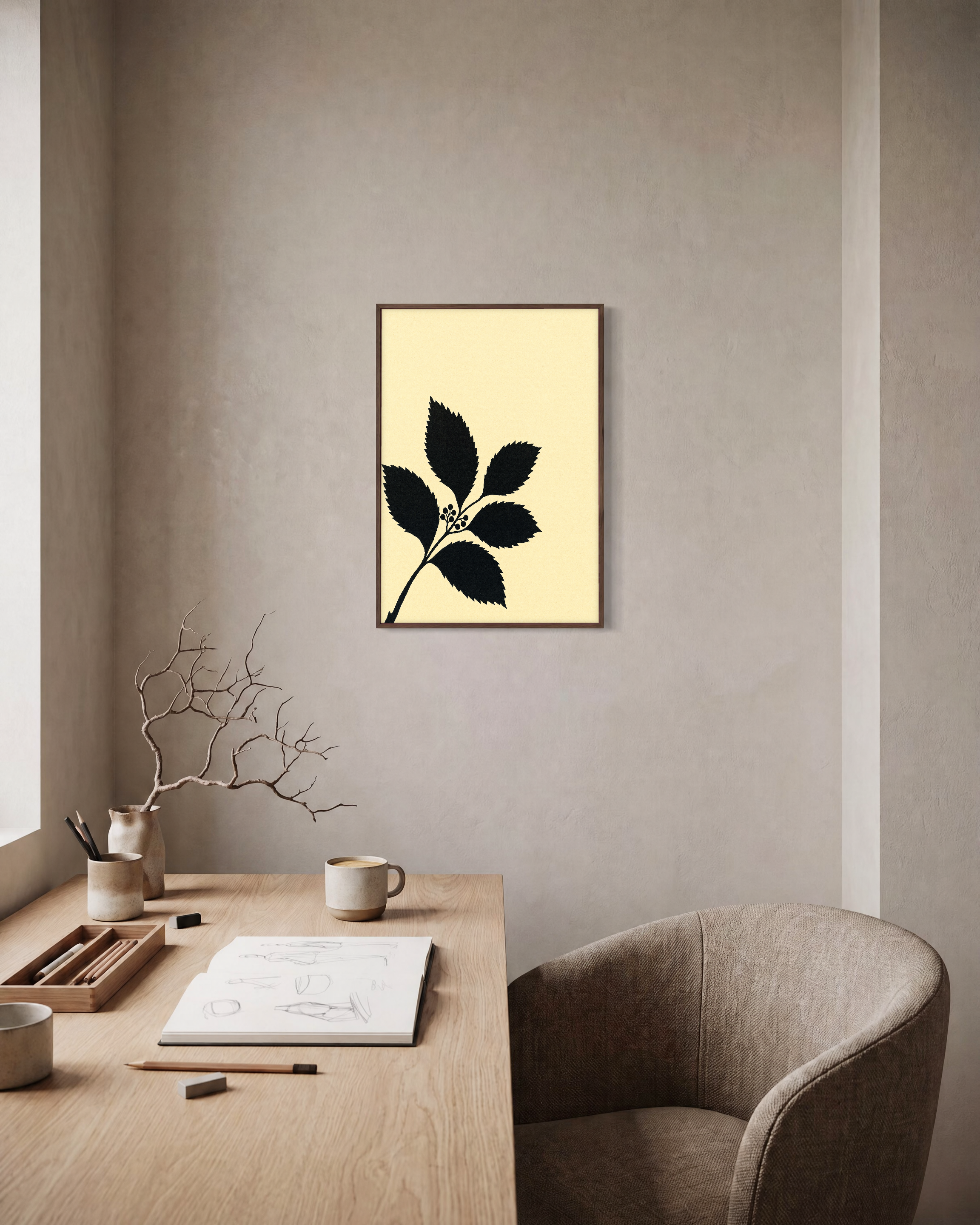 Black Leaf Sprig unframed print is shown framed for styling in a home office; frame not included