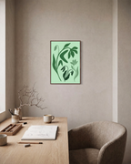 Green Wildflower unframed print is shown framed for styling in a home office; frame not included