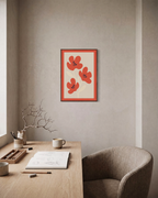 Flower Hour coral flower wall art: unframed print is shown framed for styling in a home office; frame not included