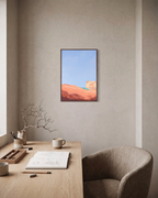 Peach Dune Blue Press edition unframed print is shown framed for styling in a home office; Frame not included