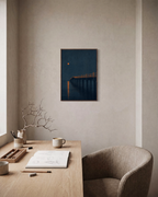 Night Pier moonlit pier print: unframed print is shown framed for styling in a home office; frame not included