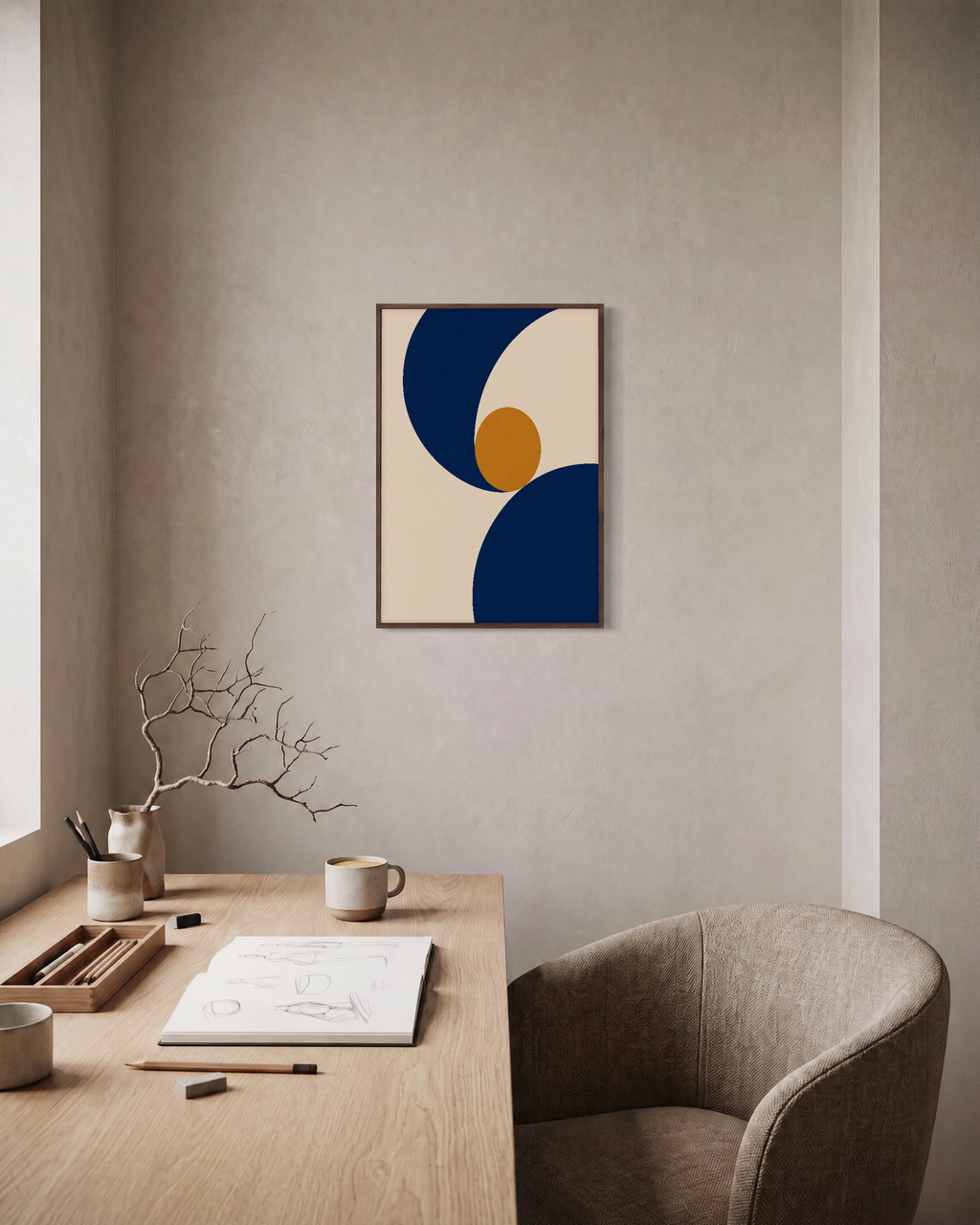Two Navy Arcs One Ochre Disk unframed print is shown framed for styling in a home office; frame not included